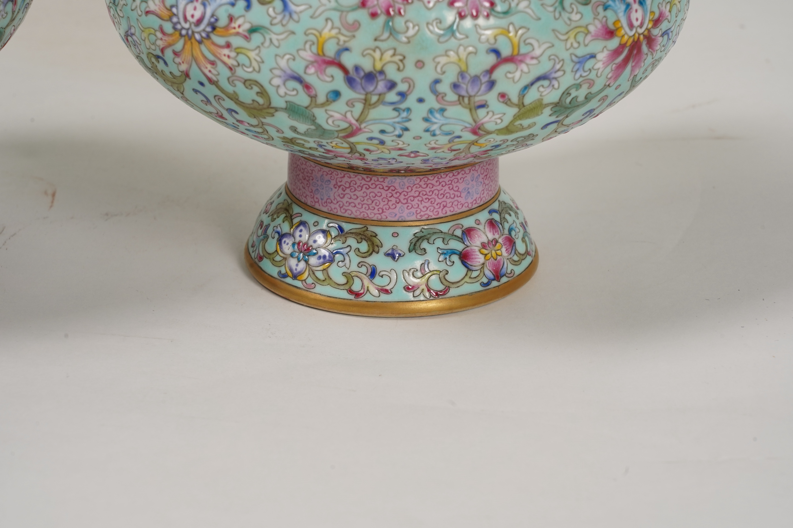 A pair of Chinese famille rose enamelled porcelain bottle vases, Qianlong seal mark to base but Republic Period